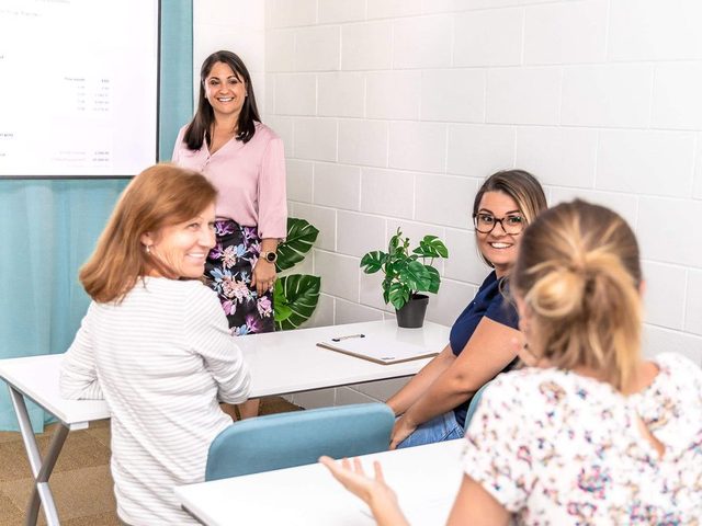 A Xero training session in progress around a table